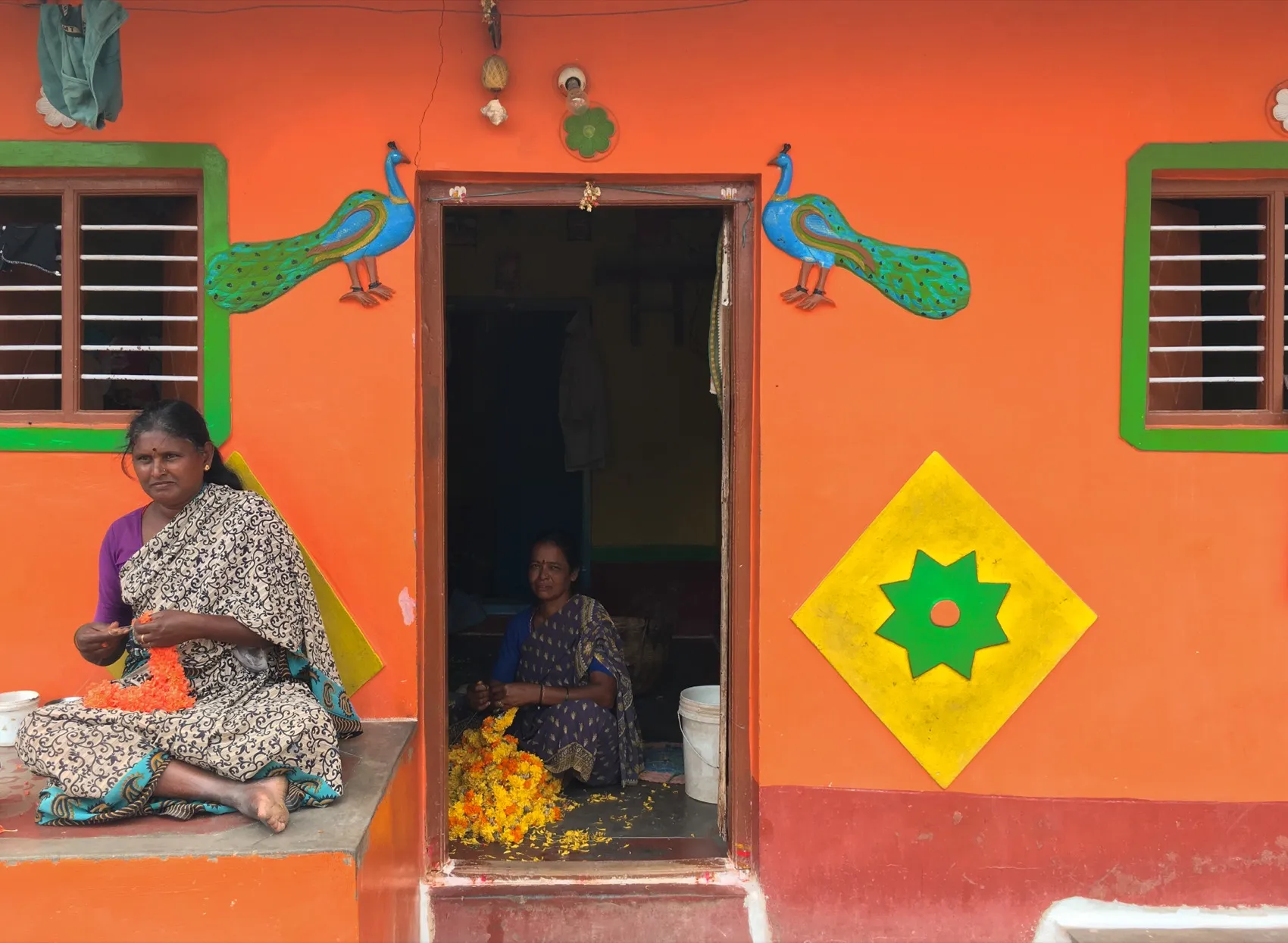Women at work outside their home, an organisation Neeyah has seen in person