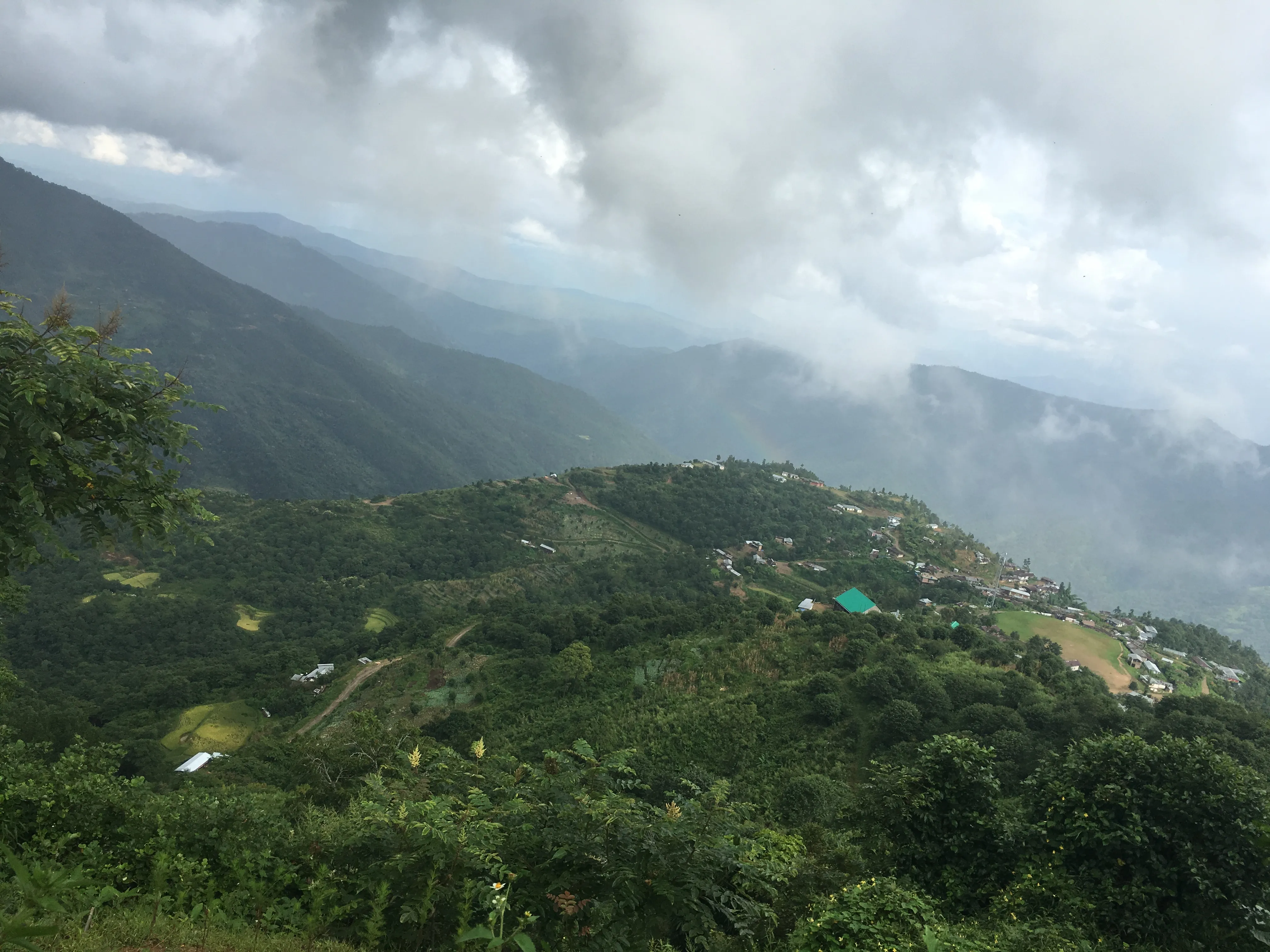A hill village overlooking a valley in India
